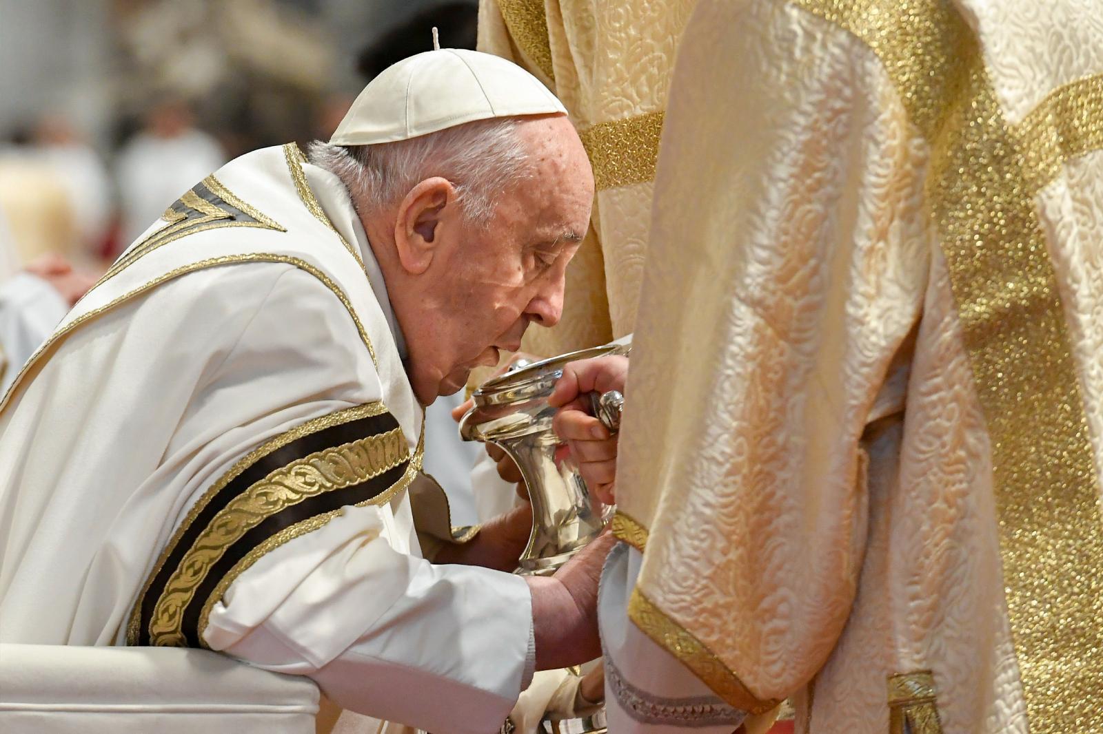 Pope Francis breathes over chrism oil
